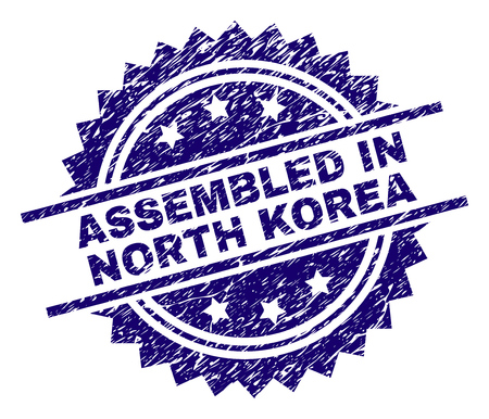 ASSEMBLED IN NORTH KOREA stamp seal watermark with distress style. Blue vector rubber print of ASSEMBLED IN NORTH KOREA text with grunge texture.のイラスト素材