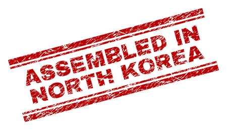 ASSEMBLED IN NORTH KOREA seal watermark with corroded texture. Red vector rubber print of ASSEMBLED IN NORTH KOREA text with dust texture. Text label is placed between double parallel lines.のイラスト素材
