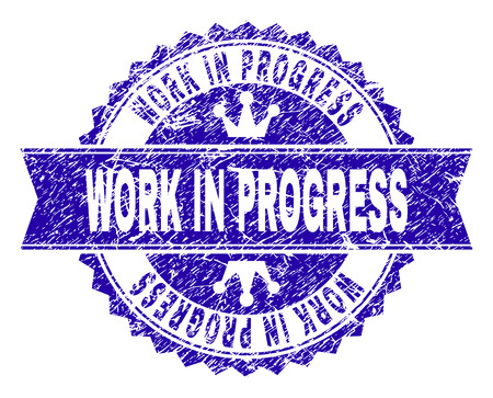 WORK IN PROGRESS rosette stamp watermark with distress style. Designed with round rosette, ribbon and small crowns. Blue vector rubber watermark of WORK IN PROGRESS caption with corroded style.のイラスト素材