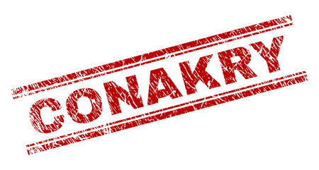 CONAKRY seal print with corroded style. Red vector rubber print of CONAKRY tag with corroded texture. Text tag is placed between double parallel lines.のイラスト素材