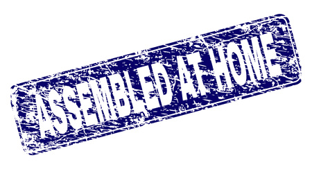 ASSEMBLED AT HOME stamp seal print with grunge texture. Seal shape is a rounded rectangle with frame. Blue vector rubber print of ASSEMBLED AT HOME title with grunge texture.のイラスト素材