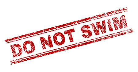 DO NOT SWIM seal print with corroded texture. Red vector rubber print of DO NOT SWIM title with corroded texture. Text title is placed between double parallel lines.のイラスト素材