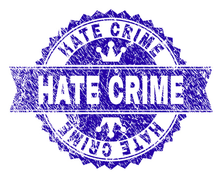 HATE CRIME rosette stamp overlay with grunge style. Designed with round rosette, ribbon and small crowns. Blue vector rubber watermark of HATE CRIME text with dust style.のイラスト素材