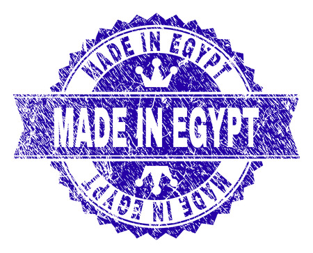 MADE IN EGYPT rosette stamp imitation with distress style. Designed with round rosette, ribbon and small crowns. Blue vector rubber print of MADE IN EGYPT text with unclean style.のイラスト素材