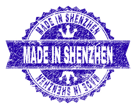MADE IN SHENZHEN rosette stamp seal watermark with grunge texture. Designed with round rosette, ribbon and small crowns. Blue vector rubber watermark of MADE IN SHENZHEN tag with retro texture.のイラスト素材