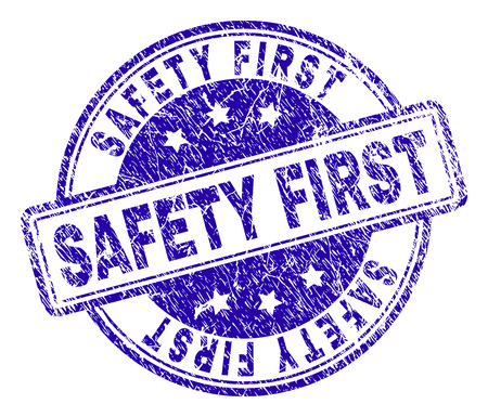 SAFETY FIRST stamp seal imprint with distress texture. Designed with rounded rectangles and circles. Blue vector rubber print of SAFETY FIRST label with scratched texture.のイラスト素材