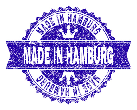 MADE IN HAMBURG rosette seal imitation with grunge style. Designed with round rosette, ribbon and small crowns. Blue vector rubber print of MADE IN HAMBURG title with dust style.のイラスト素材