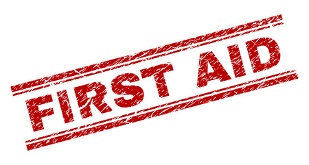 FIRST AID seal watermark with corroded texture. Red vector rubber print of FIRST AID tag with corroded texture. Text title is placed between double parallel lines.のイラスト素材