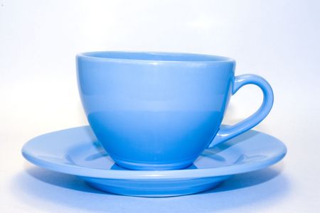 A cup with saucer on white backgroundの写真素材