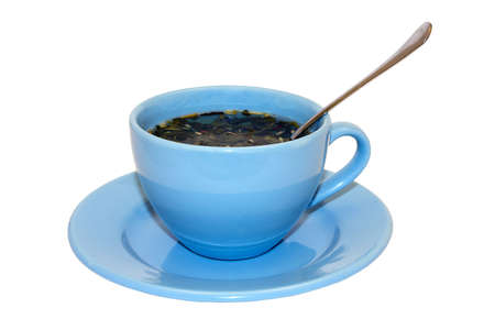 A blue cup with tea and a spoon on a white backgroundの写真素材