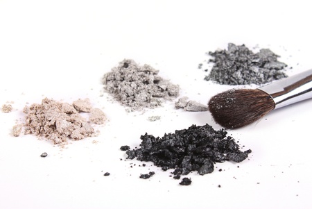 Cosmetics shadows and makeup brush on white backgroundの写真素材