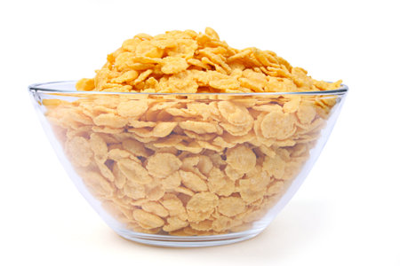 Corn flakes in bowl isolated on white