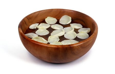 Rose Petal Spa in brown wooden bowl の写真素材