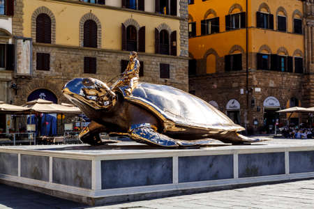 Florence, Italy - 15, June 2015: Monument of the golden turtle near the Palazzo Vecchio.のeditorial素材