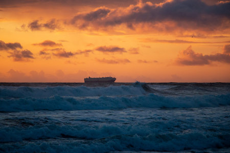 A boat and sunset off the coast of San Francisco in Northern California