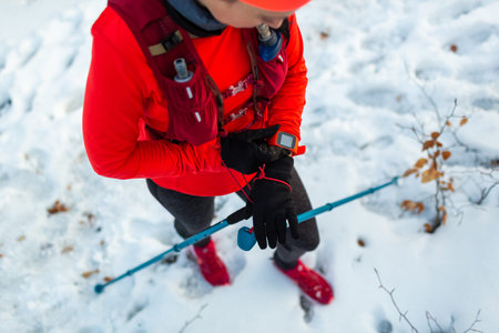 Female Runner Setting Up Fitness Smart Watch for Trail Running. Top View of Sportswoman With...