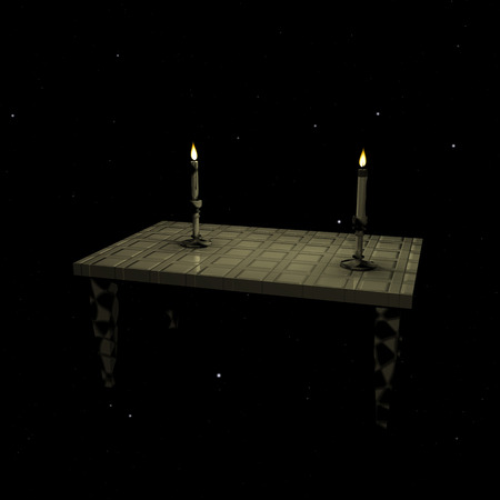 Two candles burning on the table in the night skyの写真素材