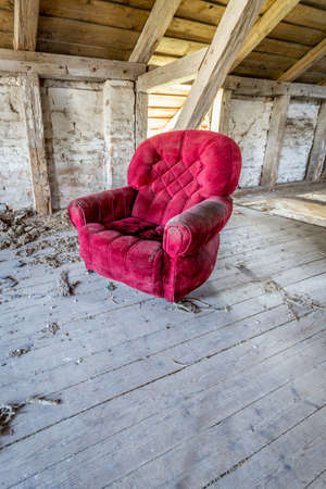 Red armchair in a barnの写真素材