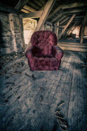 Red armchair in a barnの写真素材