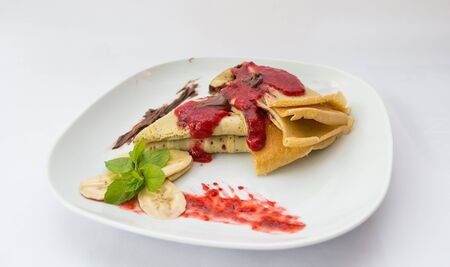 Pancakes with nutella served in the restaurant for breakfastの写真素材
