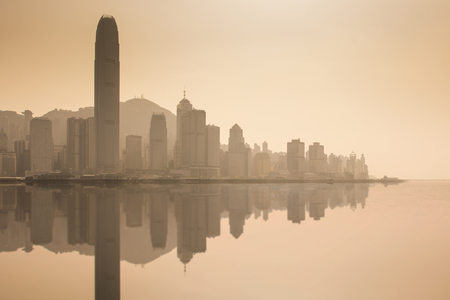 Hong Kong city skyline business district at dusk and refelction effect.の写真素材