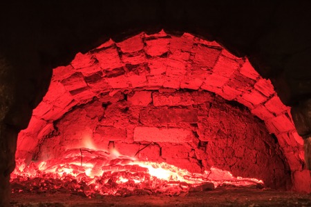 Live coals in the traditional hearth furnaceの写真素材