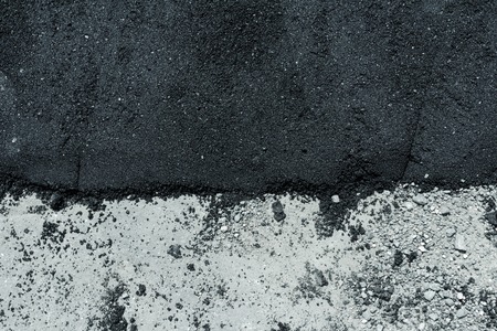  hot fresh and old layers of asphalt on road surfaceの写真素材