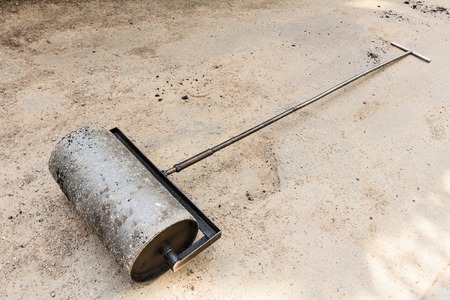 Heavy steel hand roller at asphalt の写真素材