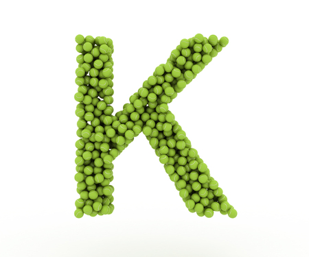 The letter K tennis balls on a white background.の写真素材