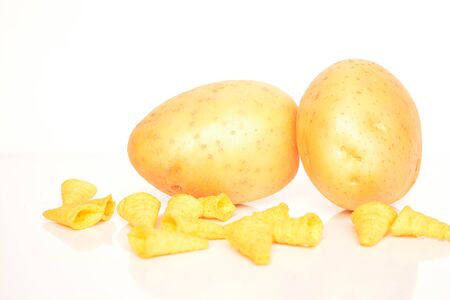 Fresh potatoes and chips on white backgroundの写真素材