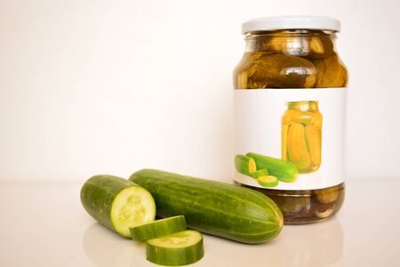 Fresh and canned cucumbersの写真素材