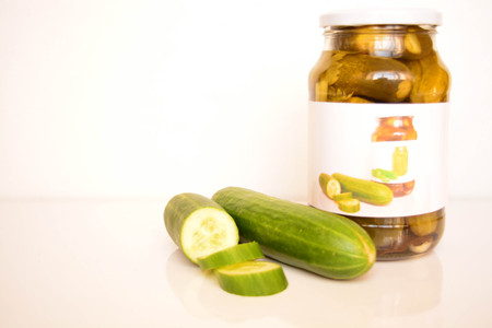 Fresh and canned cucumbersの写真素材