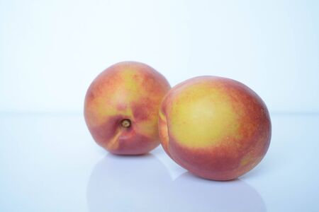 Fresh peaches on white backgroundの写真素材