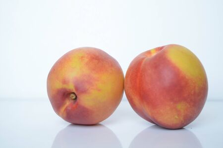 Fresh peaches on white backgroundの写真素材