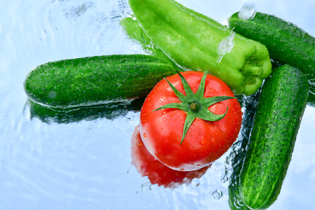 Fresh vegetables, cucumbers, tomatoes, peppersの写真素材