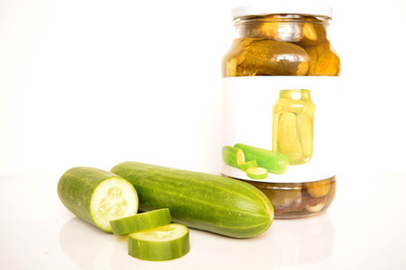 Fresh and canned cucumbersの写真素材