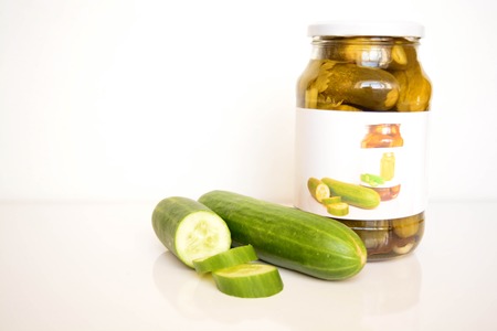 Fresh and canned cucumbersの写真素材