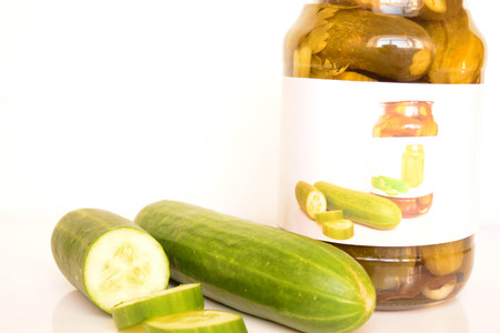 Fresh and canned cucumbersの写真素材