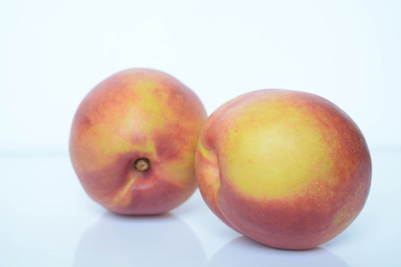 Fresh peaches on white backgroundの写真素材