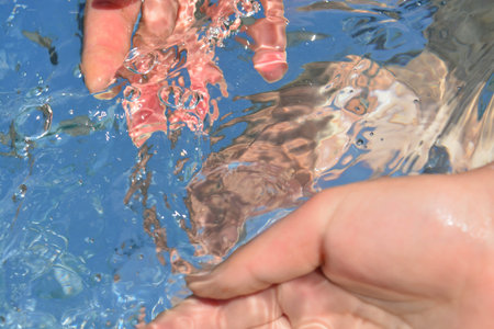 Hands on water background