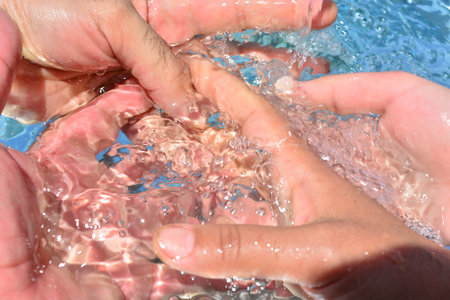 Hands on water background