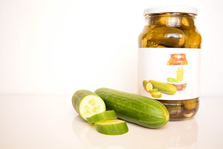 Fresh and canned cucumbersの写真素材