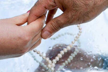 Hands reflected in pure waterの写真素材