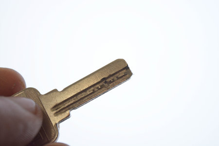 A key in hand isolated on white background, car, woman