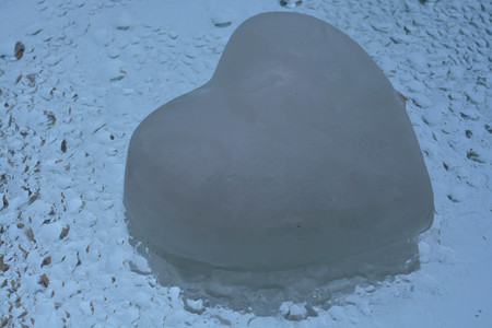 Ice heart on water backgroundの写真素材