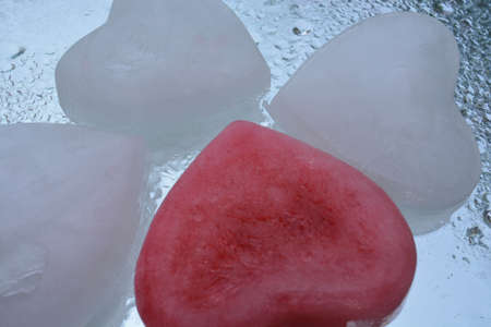 Ice heart on water backgroundの写真素材