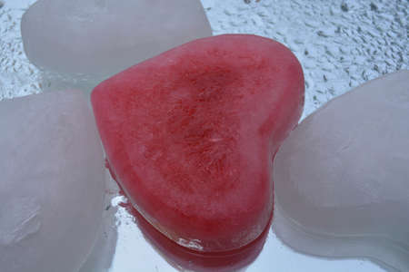 Ice heart on water backgroundの写真素材