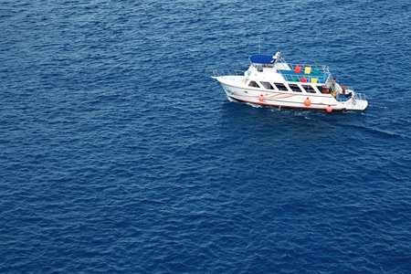 White motor boat and deep blue water.