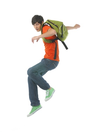 Jumping man with bag on whiteの写真素材
