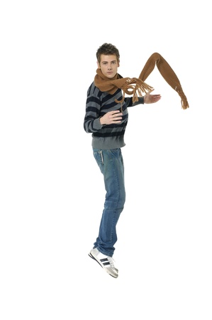 casual young man jumping の写真素材
